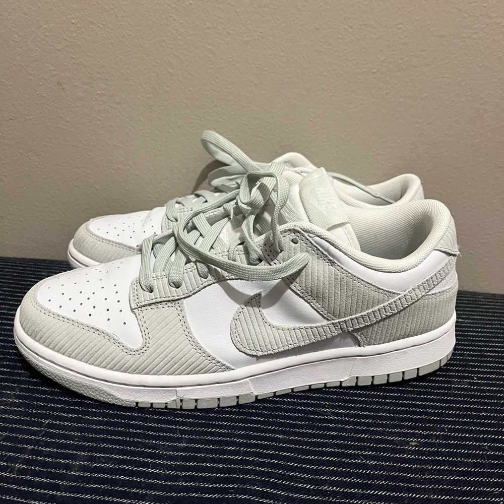 Women’s gray and white Nike dunks